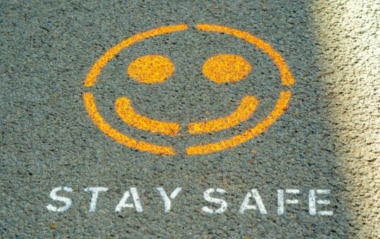Stay safe written on the floor as Anthropic has detailed its safety strategy to try and keep its popular AI model, Claude, helpful while avoiding perpetuating harms.